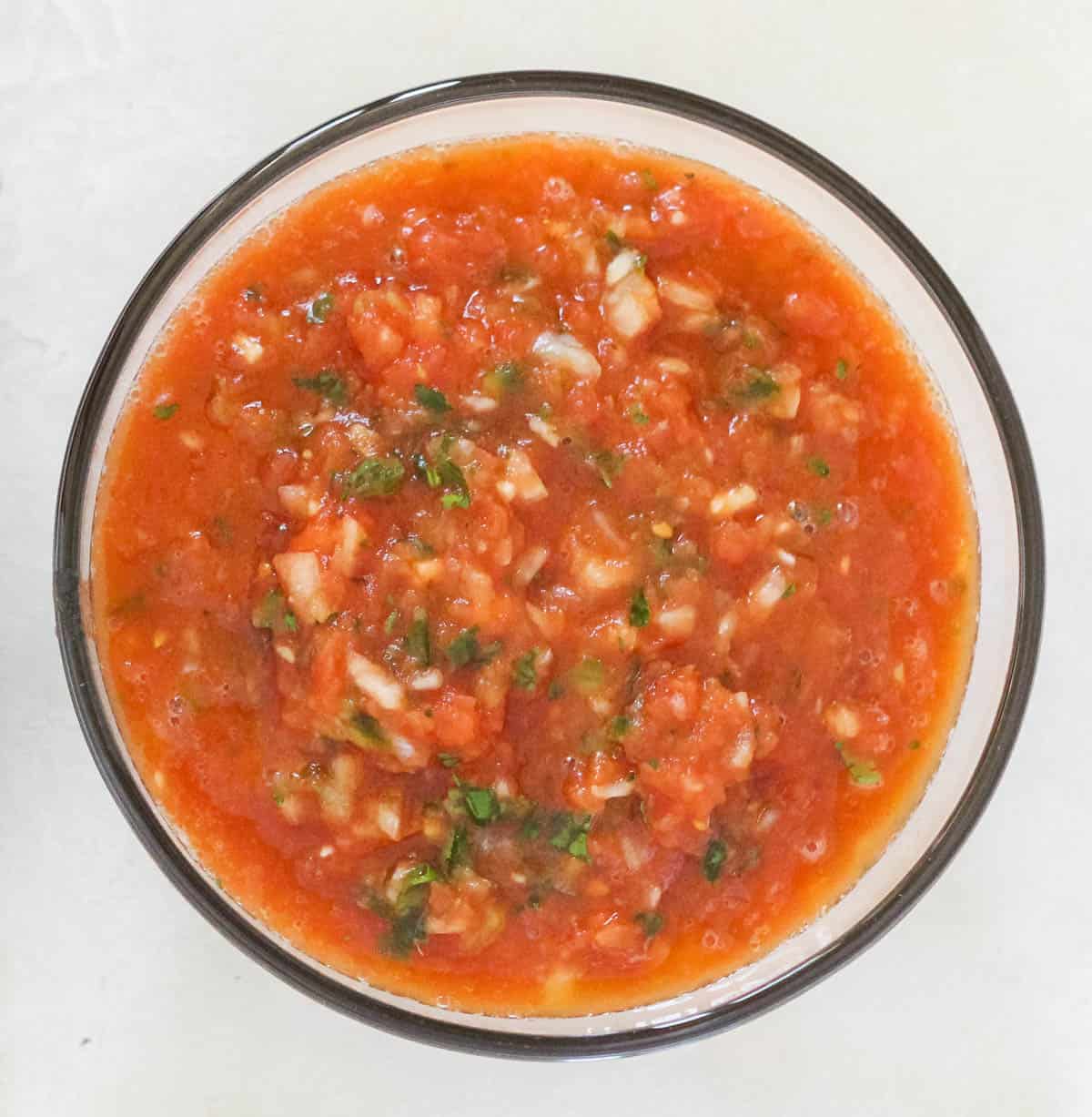 glass bowl full of homemade salsa from canned tomatoes.