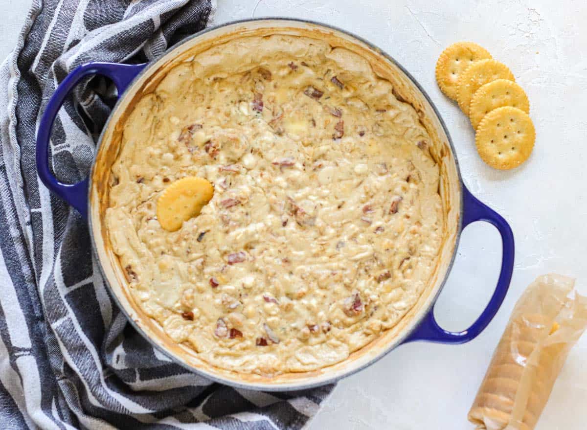 blue cheese bacon dip in a pot with butter crackers.