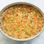halfway baked crawfish rice casserole before being topped with cheese.