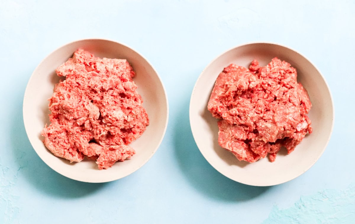 two bowls of ground beef that are grass fed and grain finished.