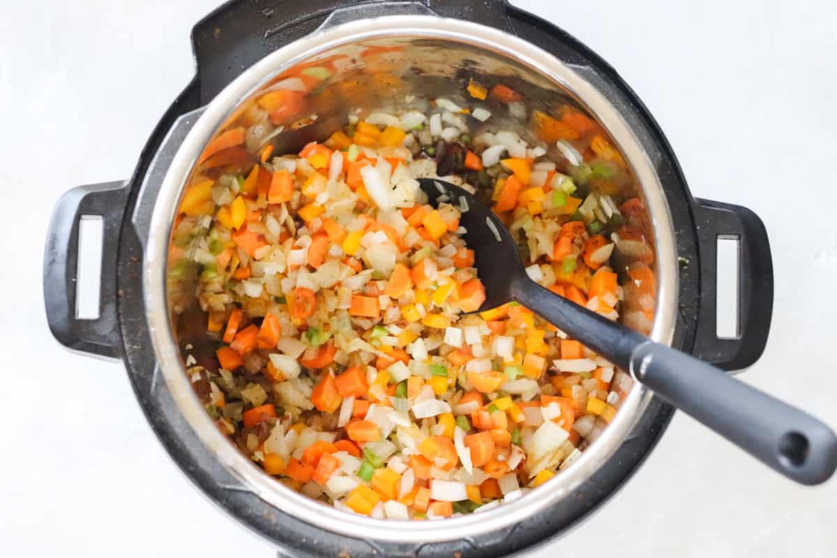 onions, bell peppers, and carrots sauteed in an instant pot.